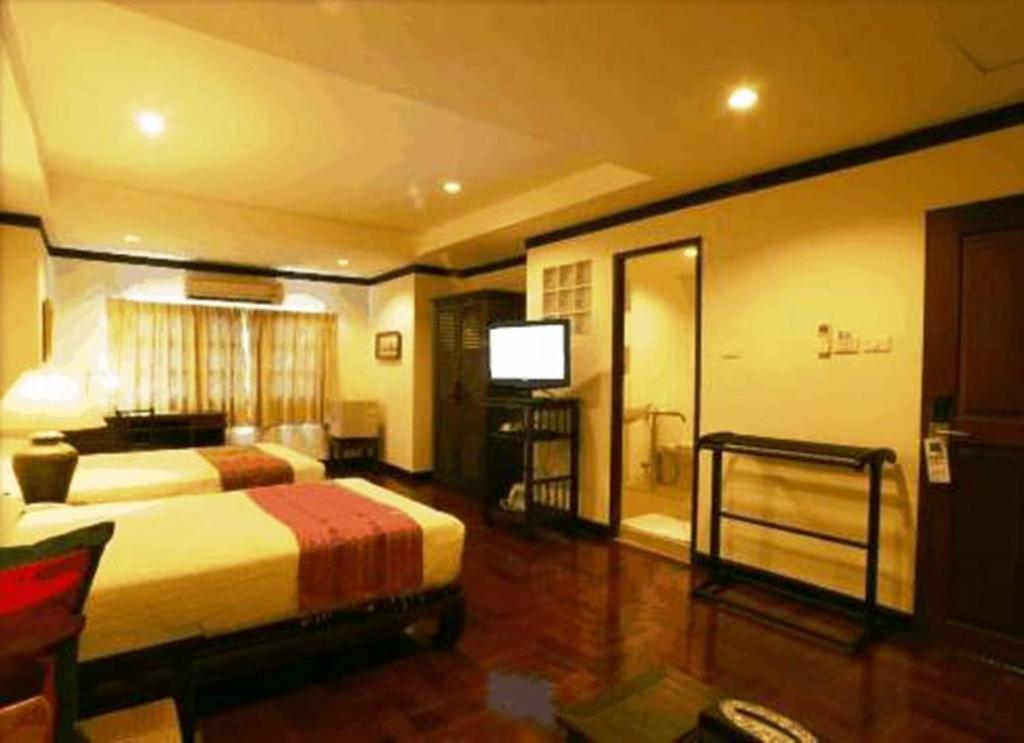 Cucumber Inn Suite Pattaya Zimmer foto